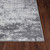 grey abstract rug closeup corner on wood floor