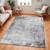 grey abstract rug in a room with matching decor