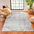 grey abstract rug in a room with matching decor