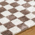 brown checker shaggy rug closeup detail