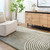 green geometric shaggy rug in a room with matching decor