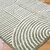 green geometric shaggy rug closeup corner on wood floor