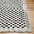 ivory black scandi rug closeup corner on wood floor