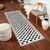 ivory black scandi rug in a room with matching decor