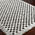ivory black scandi rug closeup corner on wood floor