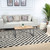 ivory black scandi rug in a room with matching decor