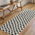 ivory black scandi rug in a room with matching decor