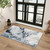 blue abstract rug in a room with matching decor