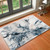 blue abstract rug in a room with matching decor
