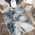 blue abstract rug in a room with matching decor