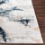 blue abstract rug closeup corner on wood floor