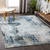 blue abstract rug in a room with matching decor
