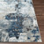 blue abstract rug closeup corner on wood floor