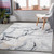 blue abstract rug in a room with matching decor