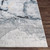 blue abstract rug closeup corner on wood floor