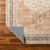 cinnamon traditional rug folded on wood floor