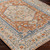 orange traditional rug closeup corner on wood floor