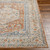 orange traditional rug closeup corner on wood floor