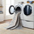 beige traditional rug in a washing machine