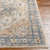 beige traditional rug closeup corner on wood floor