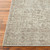 sage traditional rug closeup corner on wood floor