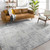 grey abstract rug in a room with matching decor