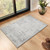 grey abstract rug in a room with matching decor