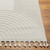 ivory berber geometric rug closeup corner on wood floor