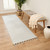 ivory berber geometric rug in a room with matching decor