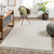 ivory berber geometric rug in a room with matching decor