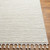 ivory berber geometric rug closeup corner on wood floor