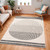 mono geometric rug in a room with matching decor