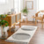 mono geometric rug in a room with matching decor