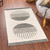 mono geometric rug in a room with matching decor
