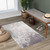 silver abstract rug in a room with matching decor