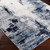 navy abstract rug closeup corner on wood floor
