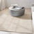 taupe calvin klein rug in a room with matching decor