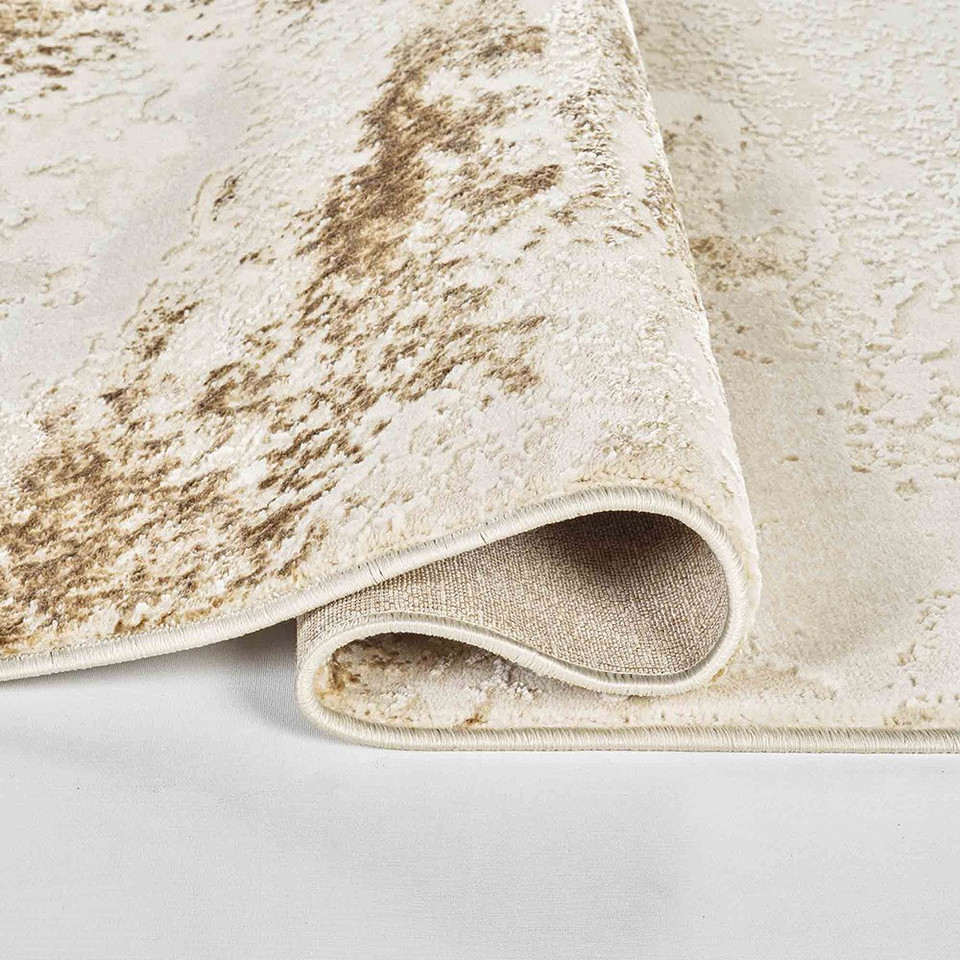 beige abstract rug folded
