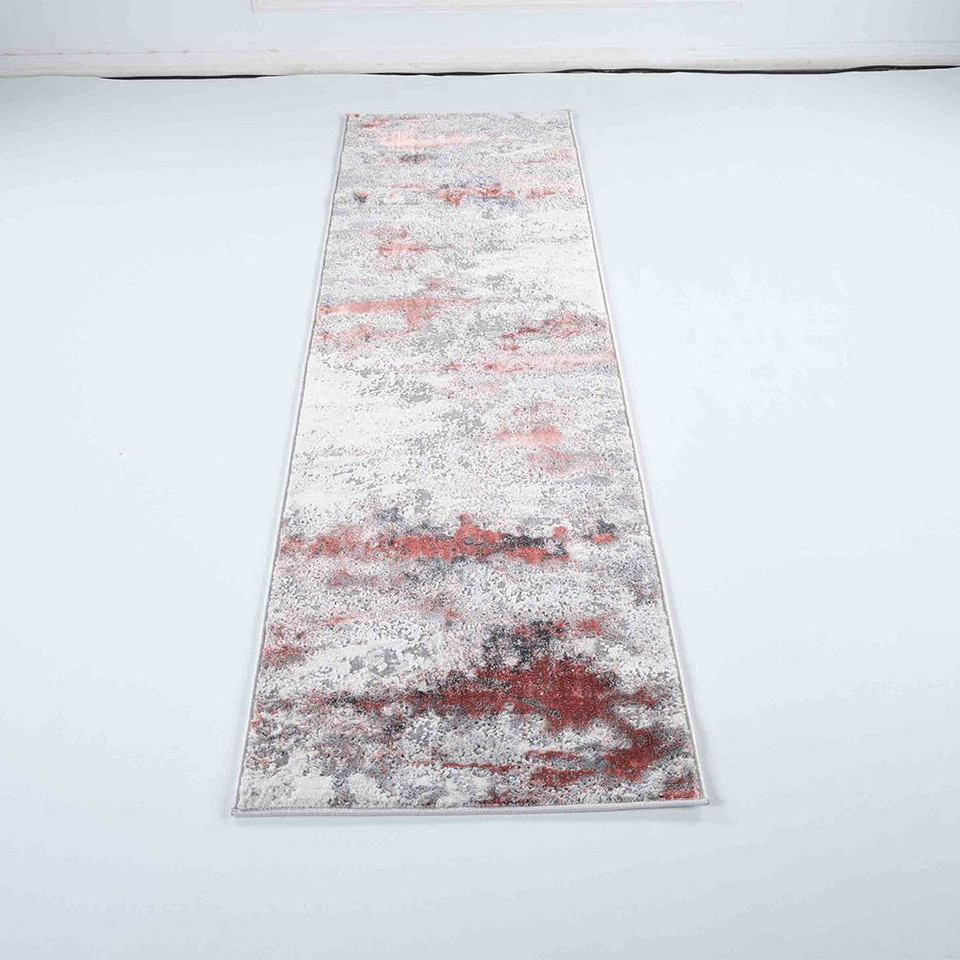 pink grey abstract rug runner in a white room