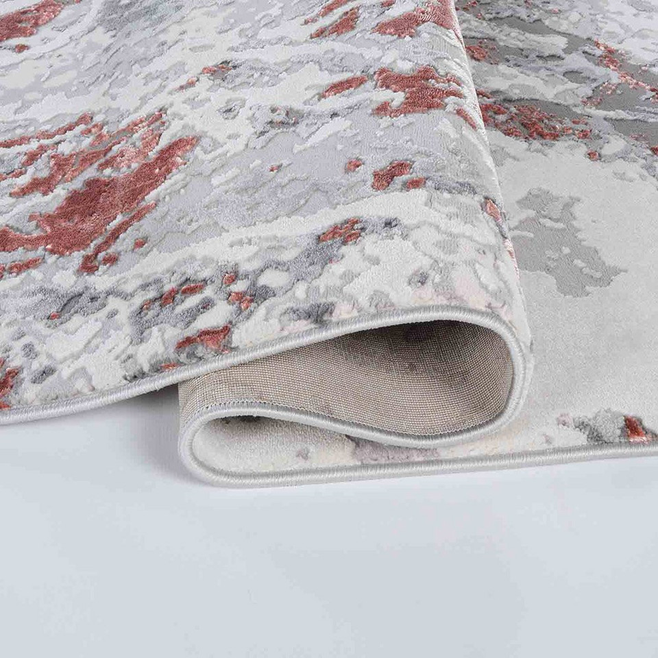 pink grey abstract rug folded