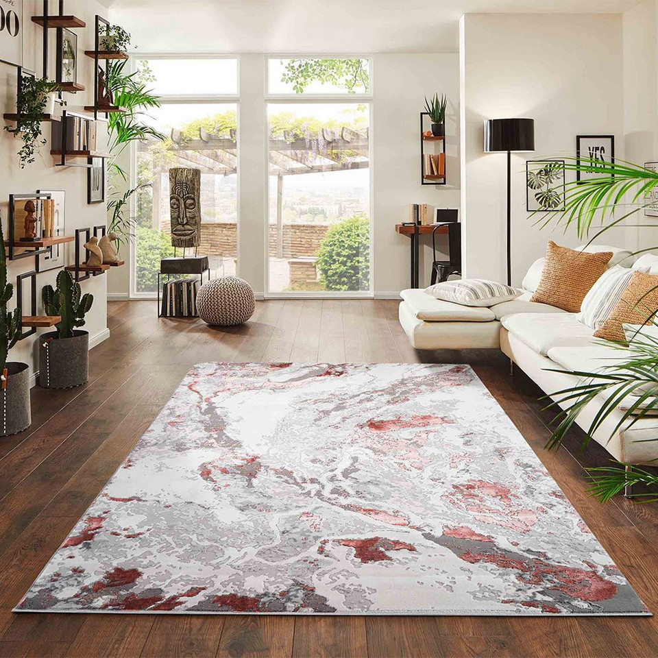 pink grey abstract rug in a living room