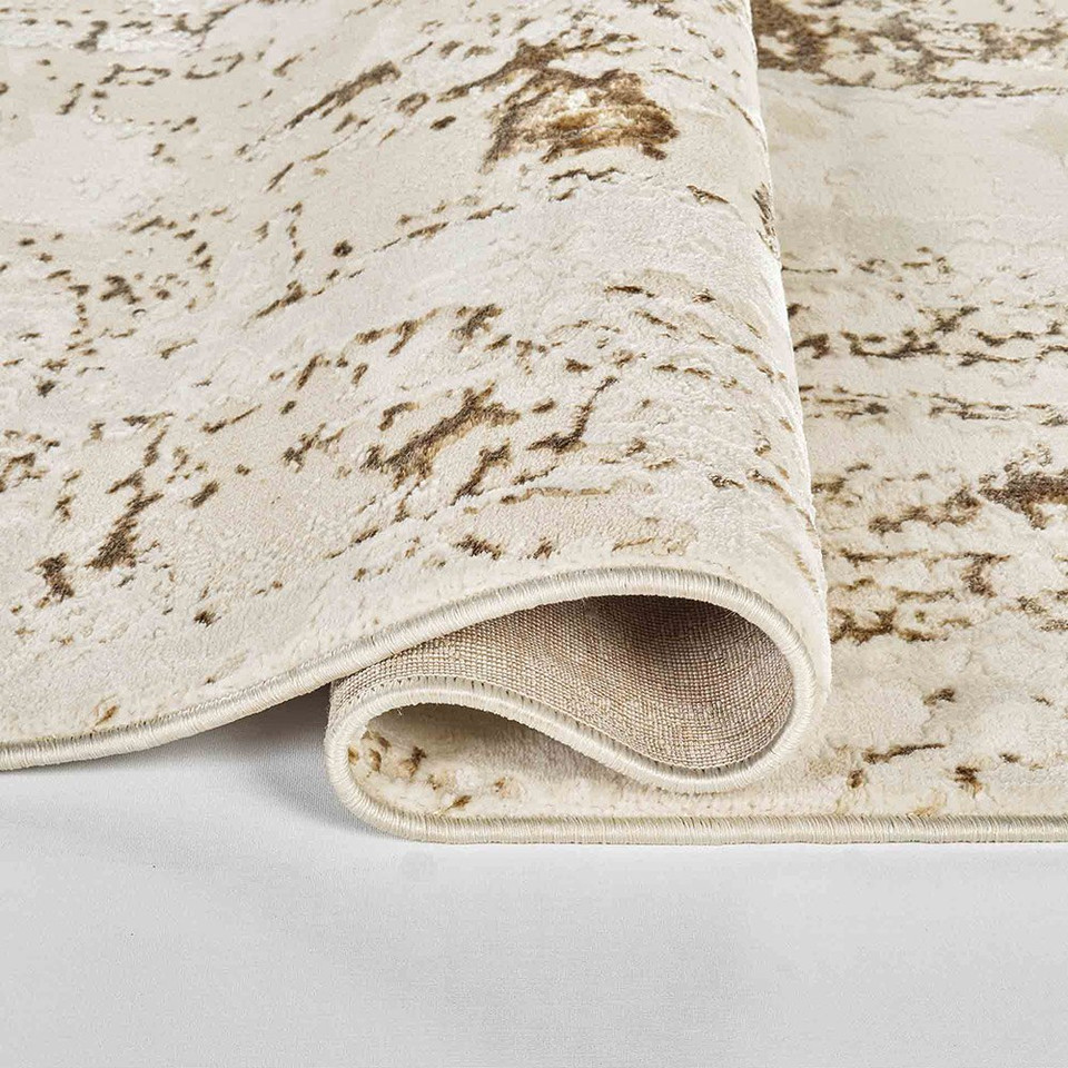 beige abstract rug runner folded on white floor