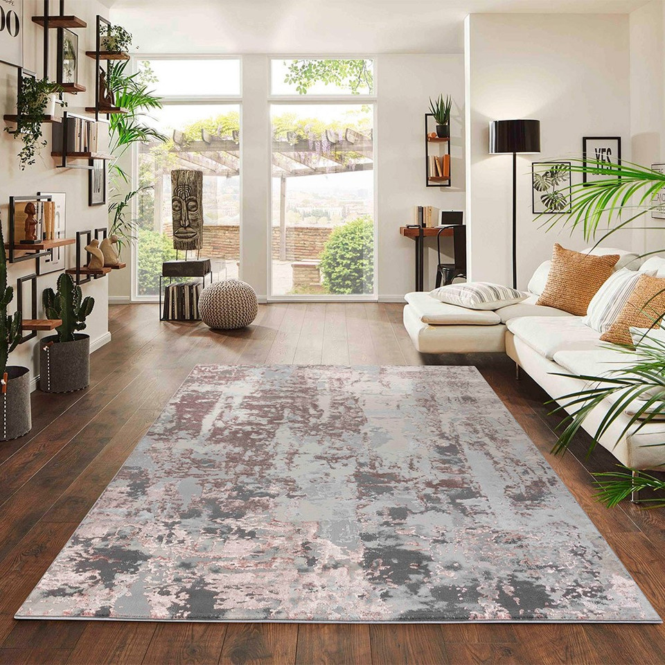 pink grey abstract rug in a living room