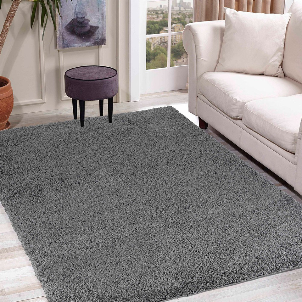 plain shaggy dark grey rug in a living room