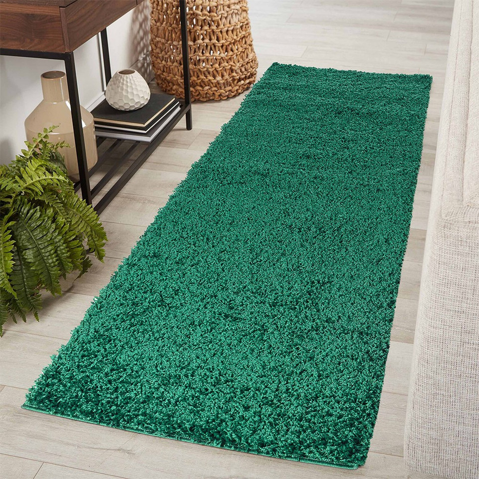 plain shaggy emerald rug runner in hallway