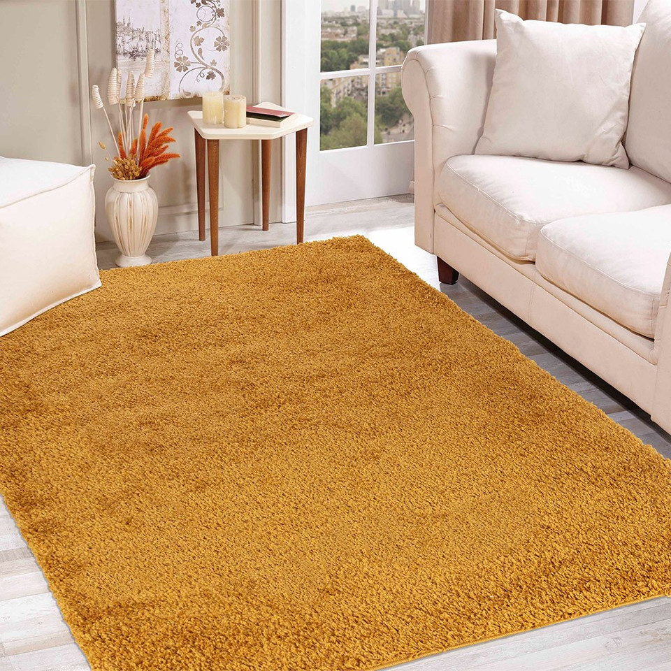 plain shaggy gold rug in a living room