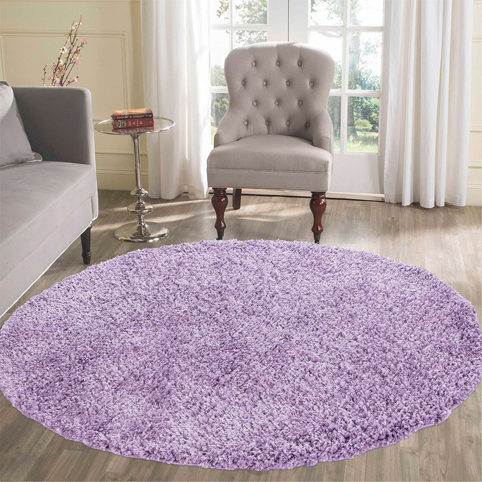 plain shaggy lilac circle rug in a living room