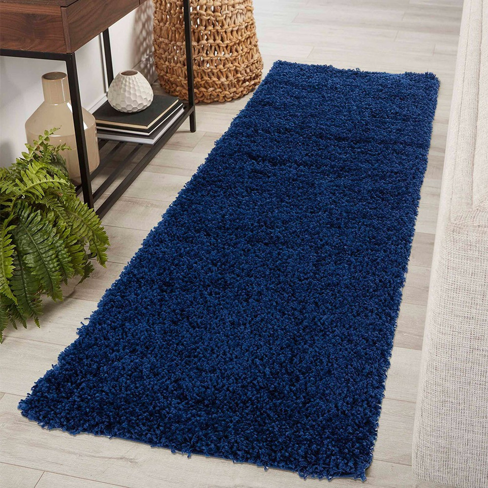 plain shaggy navy rug runner in a hallway
