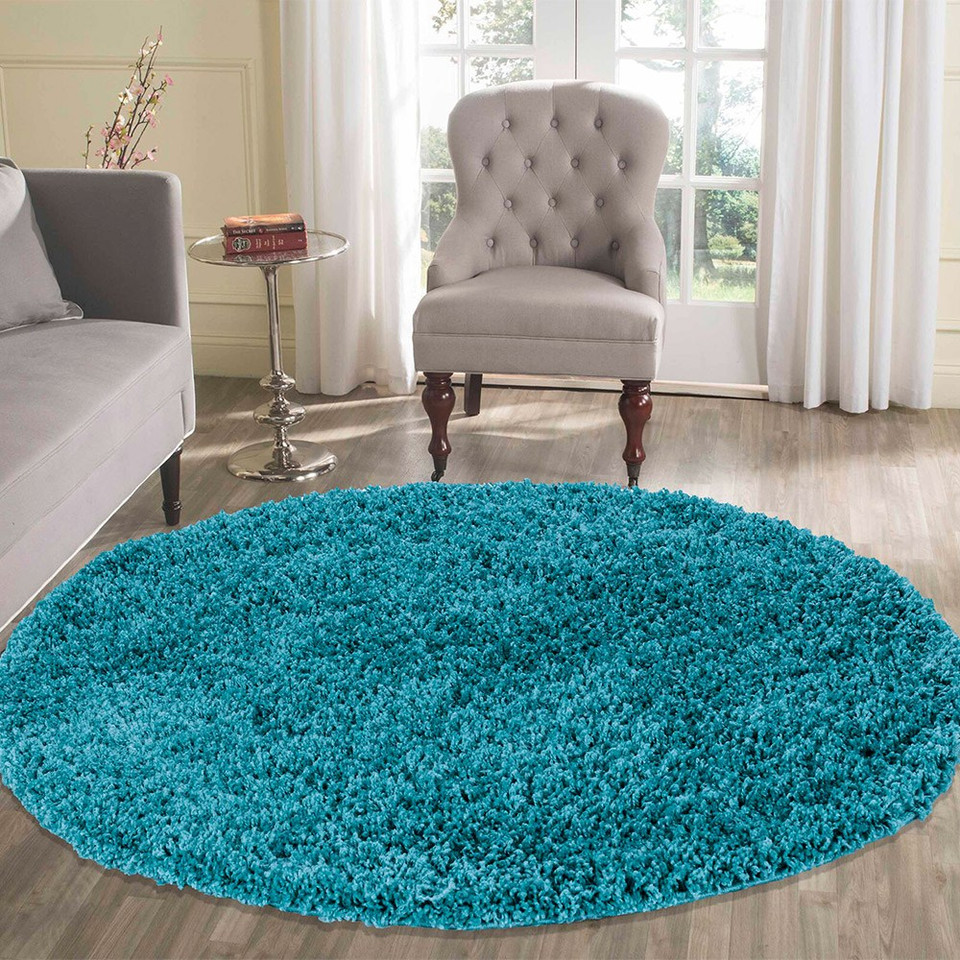 plain shaggy teal rug circle in living room