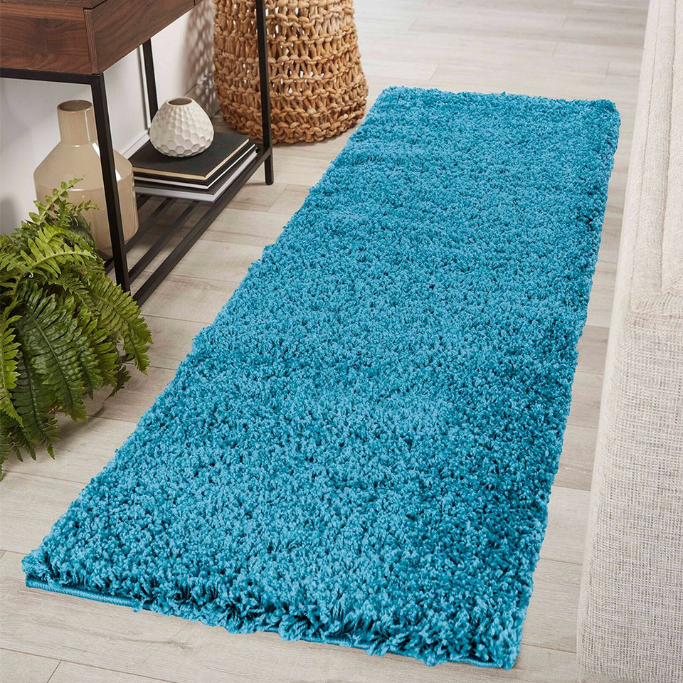 plain shaggy teal rug runner in hallway
